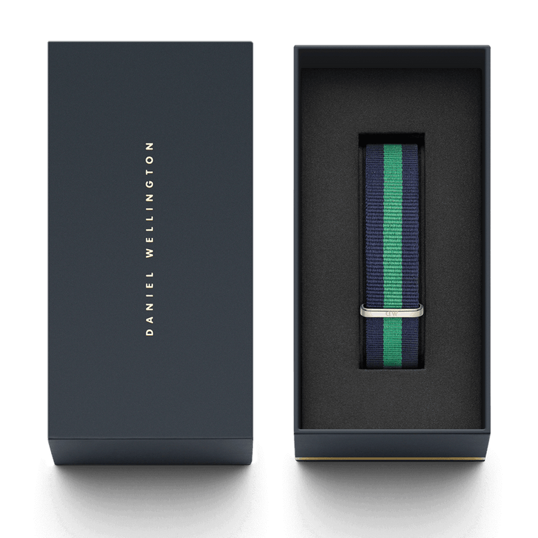 Warwick Strap Silver 20mm NATO watch strap in navy and green stripes, presented in a sleek Daniel Wellington gift box with a secure foam insert.
