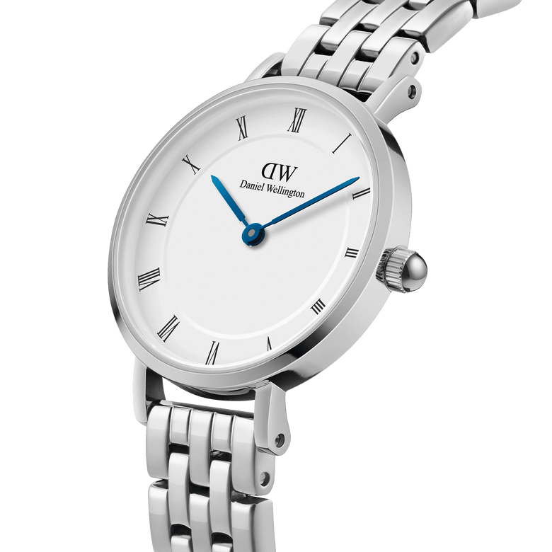 Petite Roman Numerals 5-Link Silver watch with a white dial, Roman numerals, blue steel hands, and a polished five-link stainless steel bracelet, shown in a close-up angle highlighting its minimalist design and refined finish.