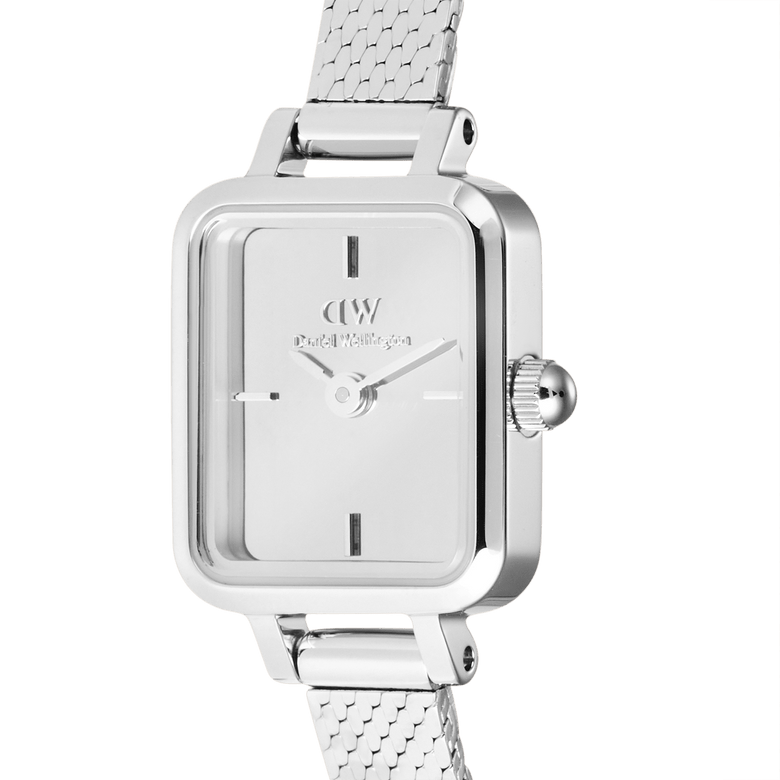 Close-up of the Quadro Mini Reflection Silver watch showing the mirror-effect silver dial, minimalist hour markers, and polished rectangular case with a fine mesh strap, highlighting its elegant and modern design.