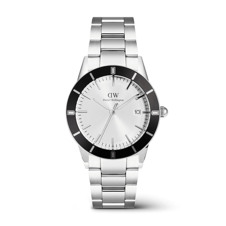 Daniel Wellington Iconic Paradigma Link Black Bezel men's watch with a 40mm stainless steel case, bold black bezel, silver dial, date window at three o'clock, and a three-link bracelet with a satin matte and polished finish.