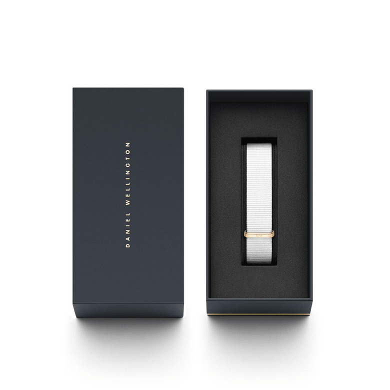 Dover Strap Rose Gold presented in a sleek Daniel Wellington gift box, featuring a white NATO style polyester strap with a rose gold buckle for a refined, modern look.