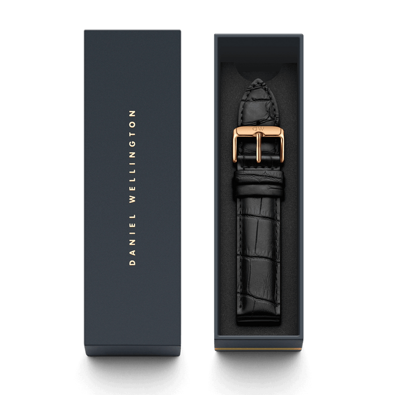 Reading Strap Rose Gold presented in a Daniel Wellington gift box, featuring black pressed croc leather and a polished rose gold buckle for a refined, modern finish.