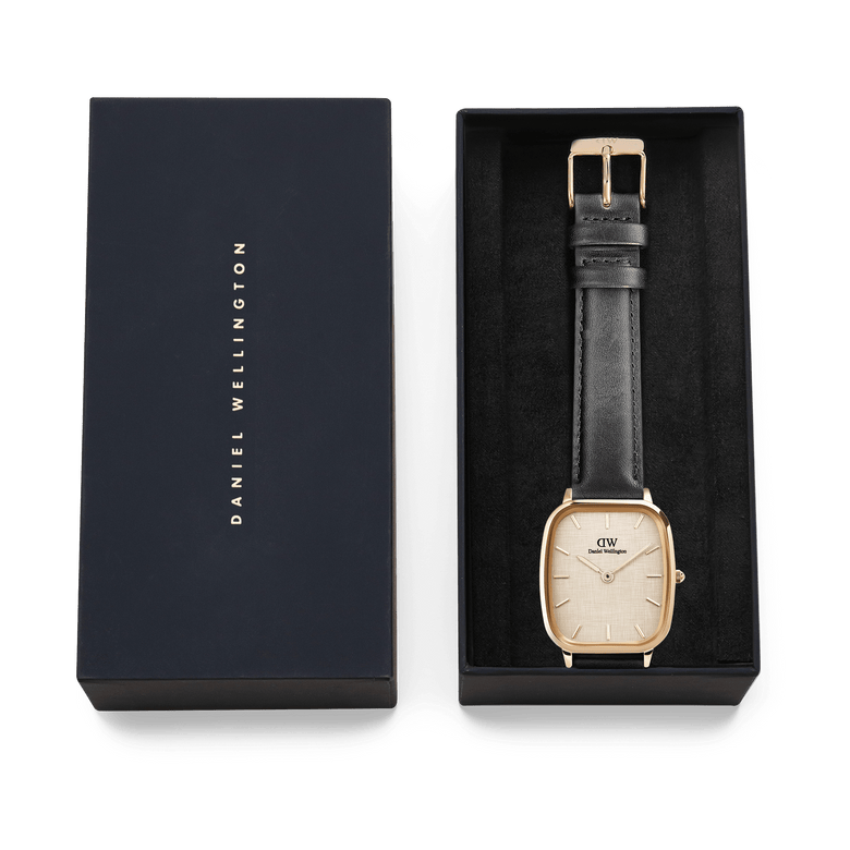 Marlon Sheffield Linen Gold men's watch presented in a Daniel Wellington gift box, featuring a cushion-shaped gold case, linen-textured dial, and classic black leather strap, ideal for gifting or adding to a collection.