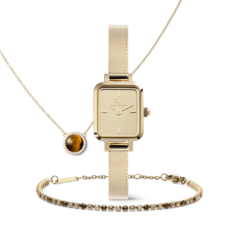 Honey Gold Set featuring a square gold watch with a mesh strap, a tennis bracelet with sparkling stones, and a pendant necklace with a tiger eye gemstone framed by crystals, all presented in a coordinated gold jewellery trio.