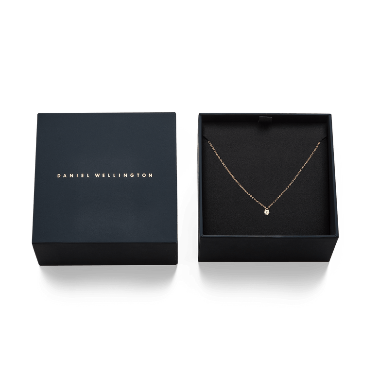 Mirelle Solitaire Necklace Rose Gold displayed in an elegant black gift box, highlighting the delicate rose gold chain and white cubic zirconia pendant.