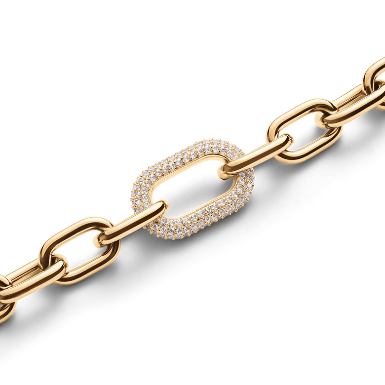 Close-up of the Crystal Link Bracelet Gold showing chunky gold-plated links and a pavé crystal-embellished ring, highlighting the refined detail and shimmering finish.