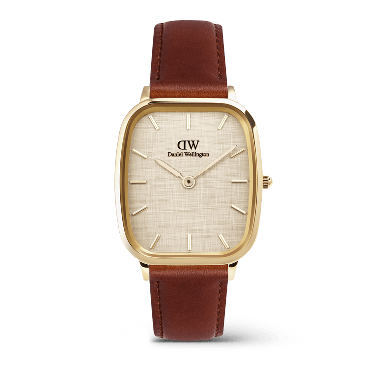 Men’s Daniel Wellington Marlon St Mawes Linen Gold watch with a cushion-shaped gold case, linen-textured dial, minimalist gold-tone markers, and a brown leather strap.