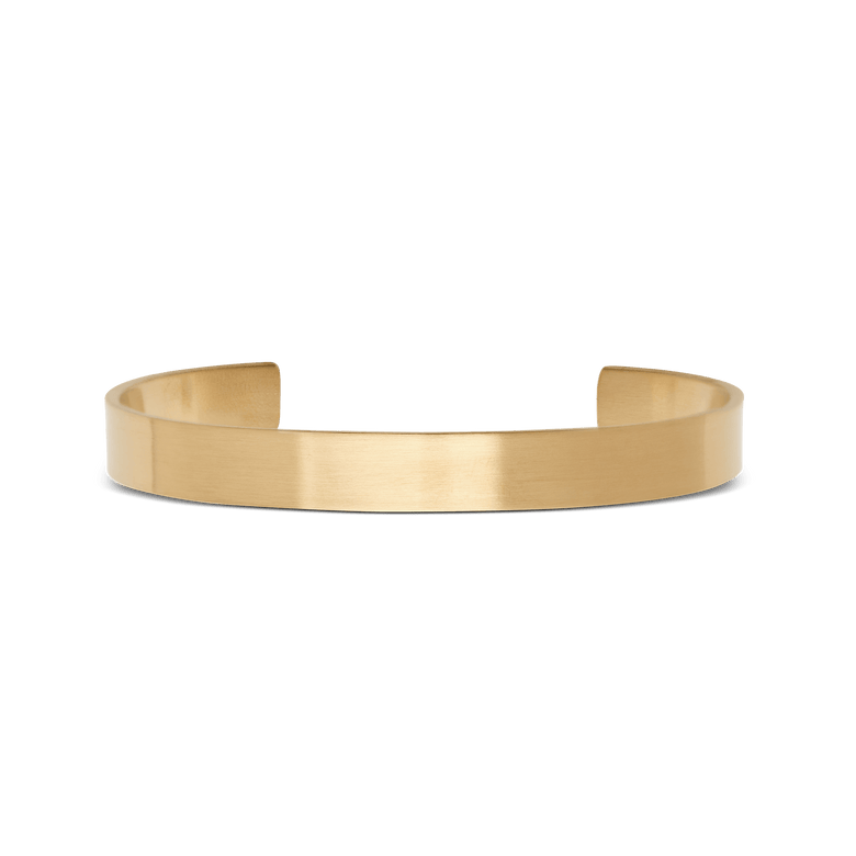 Line Cuff Brushed Gold features a minimalist open cuff design in brushed gold-tone stainless steel, with a smooth 7 mm wide band and a subtle matte finish.