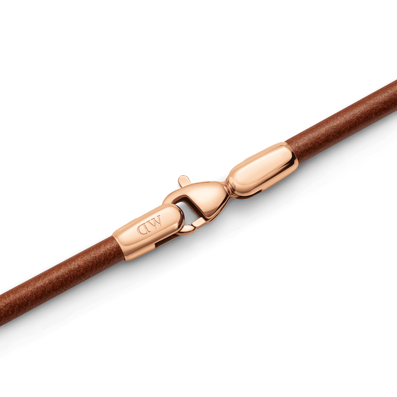 Close-up of the St Mawes Bracelet Rose Gold, showing the brown leather band and rose gold-plated stainless steel lobster clasp with a secure fastening.