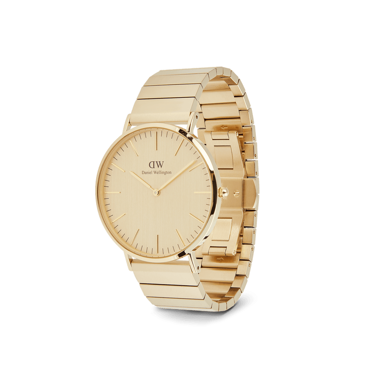 Classic Piano Link Gold Unitone men’s watch with a brushed gold dial, minimalist markers, and a geometric piano link bracelet, shown at an angle to highlight its slim profile and polished gold finish.