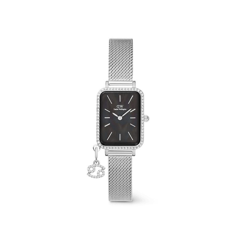 Elegant Daniel Wellington Quadro Crystal Zodiac Sterling Set featuring a rectangular silver case with crystal detailing, a black mother of pearl dial, and a silver mesh strap with a sparkling zodiac charm.