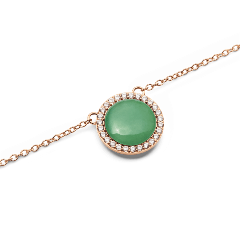Close-up of the Audrey Necklace Jade Rose Gold pendant, showcasing a polished green jade stone encircled by white cubic zirconia crystals on a rose gold chain.