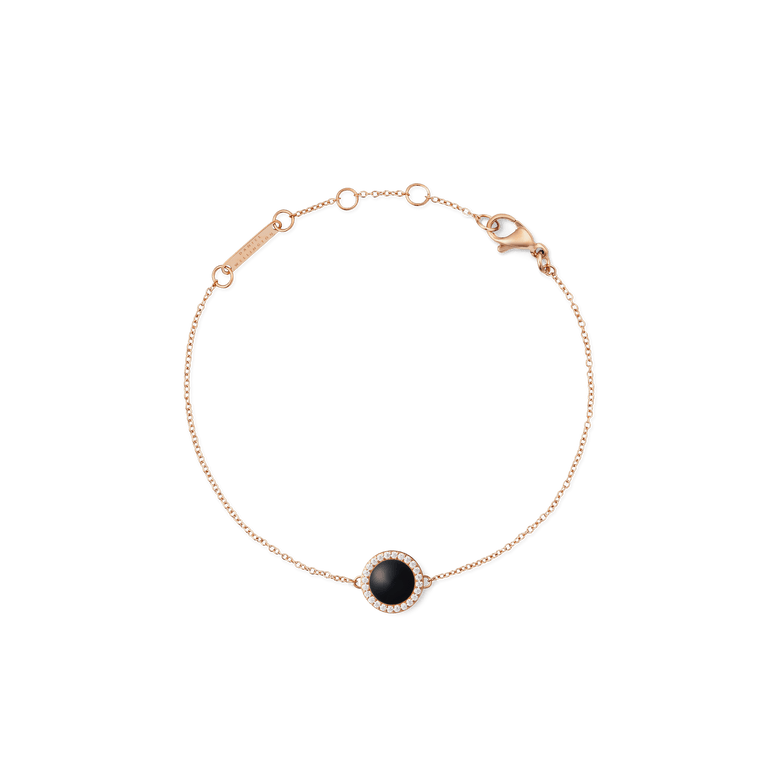 Delicate rose gold bracelet featuring a slim adjustable chain and a round black agate centrepiece framed by white cubic zirconia, designed for a refined and modern look.