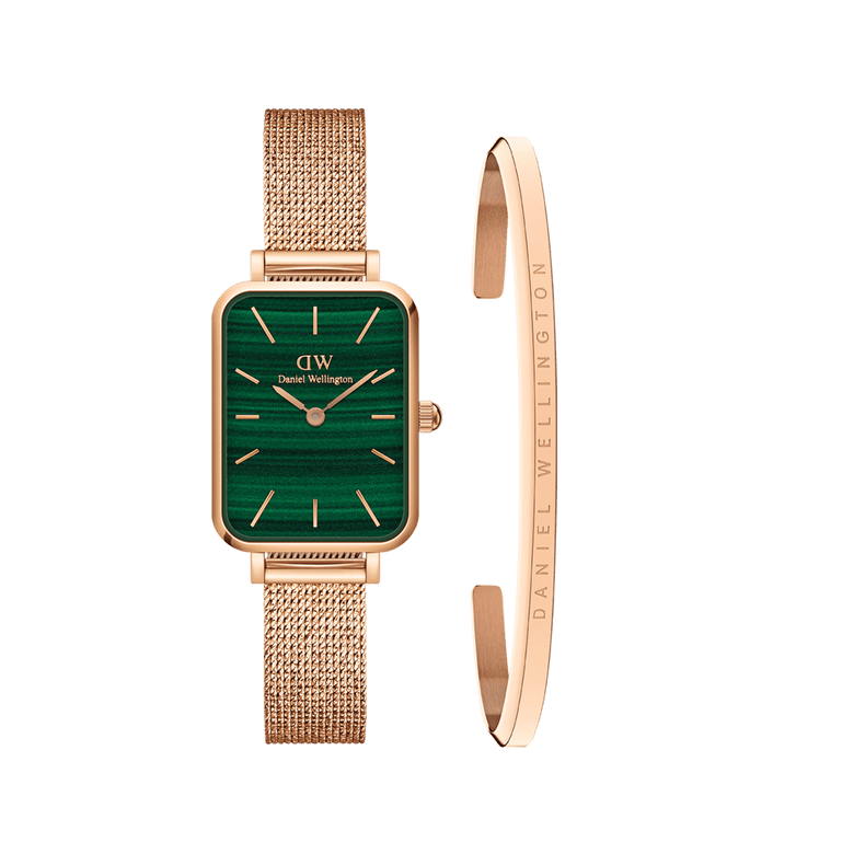Rose gold ladies watch with a rectangular green dial and pressed mesh strap, paired with a slim rose gold bracelet engraved with Daniel Wellington branding, shown as a coordinated accessory set.