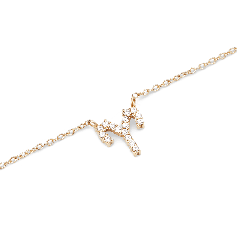 Gold chain necklace featuring a fixed Aries zodiac pendant, set with sparkling crystals for a refined and personal touch.