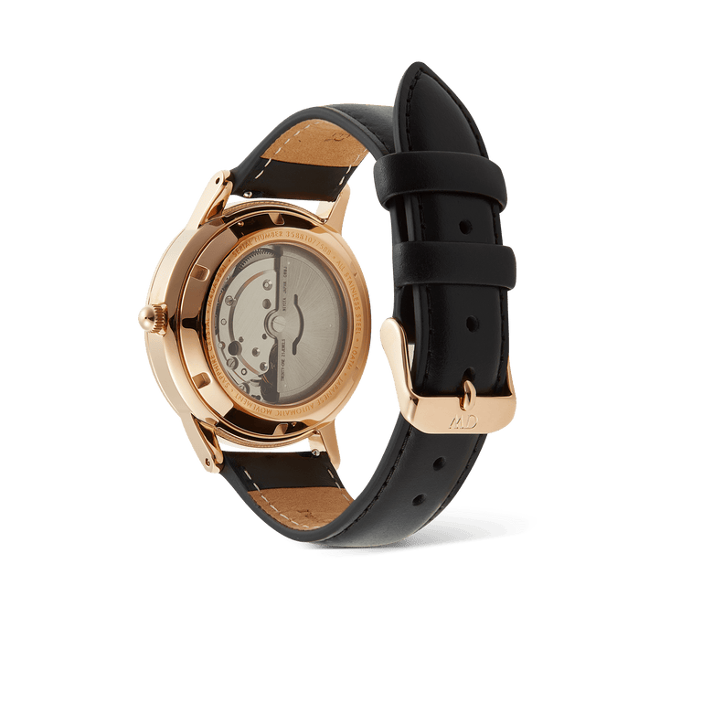 Rear view of the Daniel Wellington Iconic Sheffield Automatic Rose Gold watch, showing the exhibition case back with visible Japanese automatic movement and genuine black leather strap.