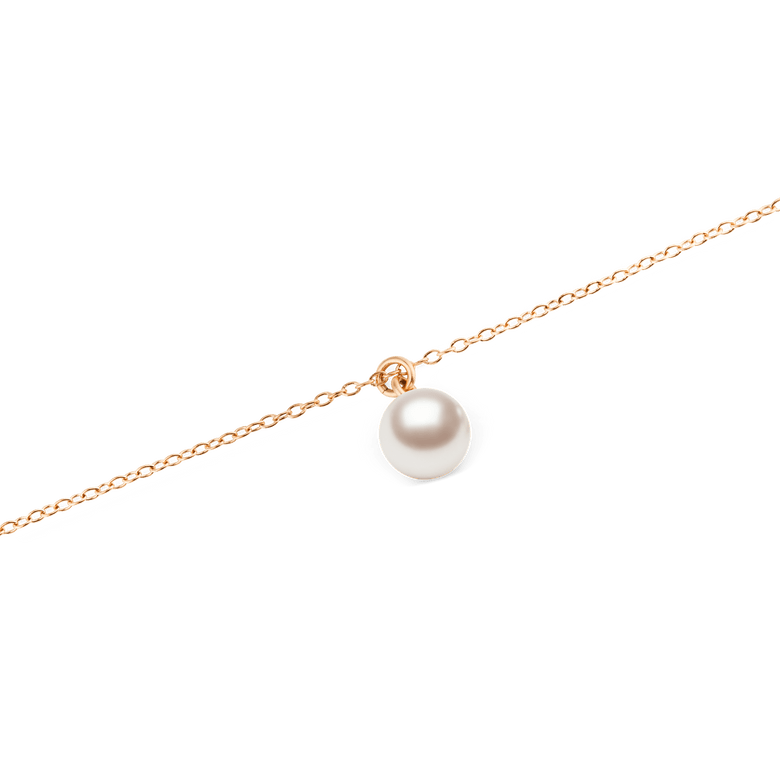 Close-up of the Pearl Necklace Rose Gold, showcasing its single Swarovski glass pearl pendant suspended from a fine rose gold chain with a polished, minimal design.