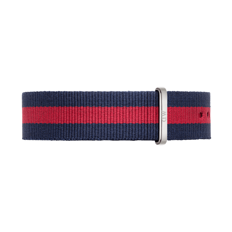 Oxford Strap Silver features a navy blue and red striped NATO style watch strap in durable polyester, finished with a polished silver buckle and adjustable holes for a tailored fit.