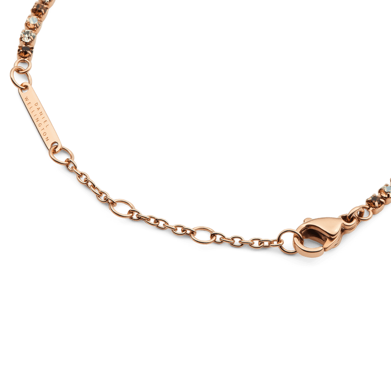 Detail of the Classic Tennis Bracelet Honey Combo Rose Gold, highlighting the rose gold adjustable chain, secure lobster clasp, and alternating honey and clear crystals.