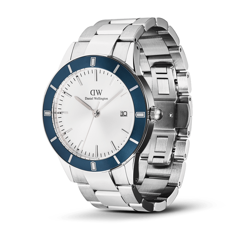 Iconic Paradigma Link Blue Bezel Silver men’s watch featuring a satin matte blue bezel, white dial with minimalist index markings, date display, and a polished stainless steel three-link bracelet.