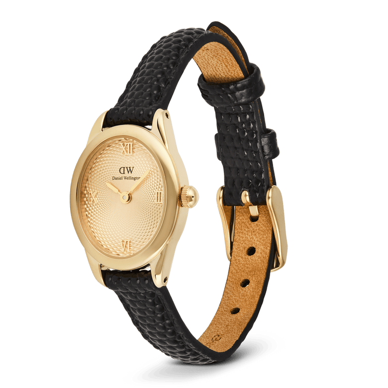 Daniel Wellington Ophelia Mini Black Lizard Unitone Guilloché Gold watch with a slim oval gold case, textured gold dial with Roman numerals, and an adjustable black lizard-embossed leather strap.