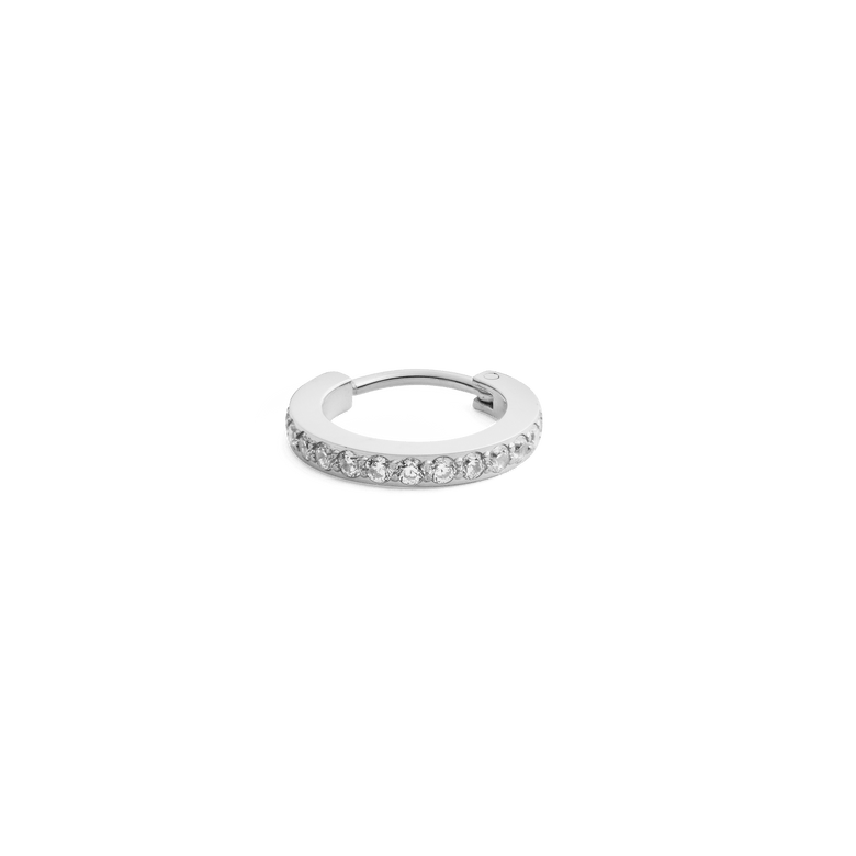 Silver hoop earring featuring a row of sparkling cubic zirconia crystals, crafted from stainless steel with a secure clasp and minimalist design.