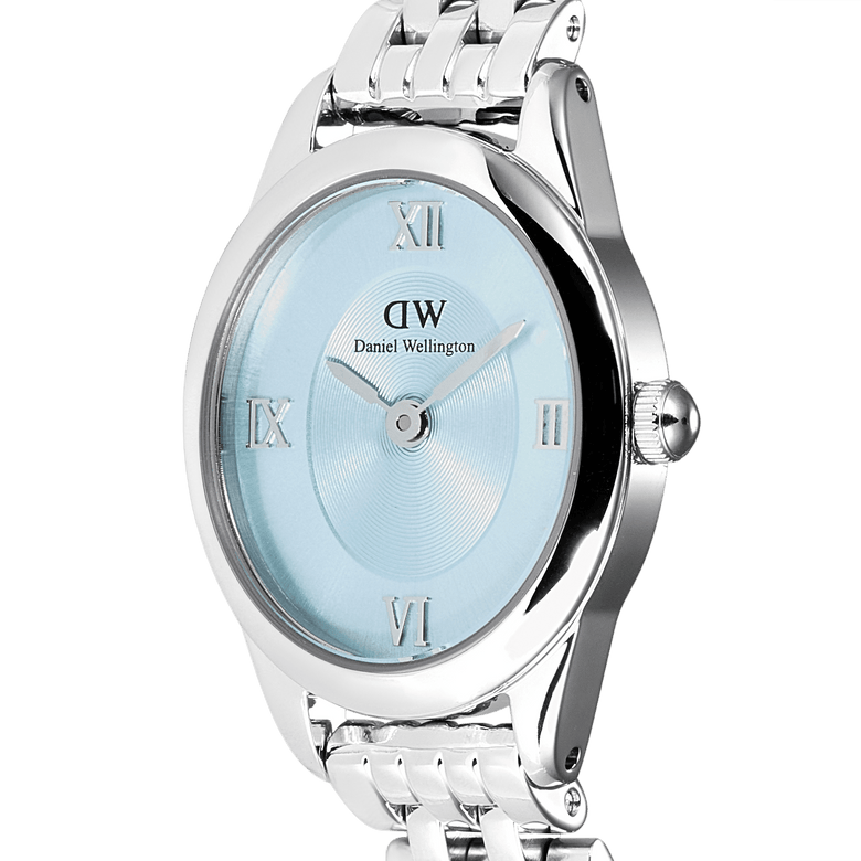 Close-up of the Ophelia Mini Ice Blue Silver watch, highlighting the oval polished silver case, ice blue sunray dial with silver Roman numerals, and the elegant 5-link stainless steel bracelet.