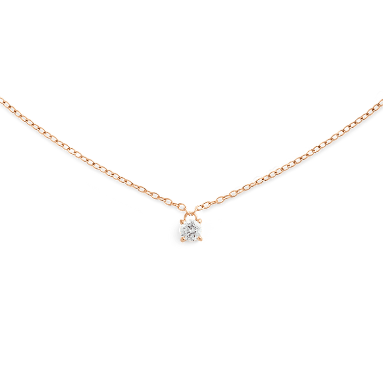 A delicate rose gold necklace featuring a fine chain and a single petite white cubic zirconia solitaire pendant, designed for a minimalist and elegant look.