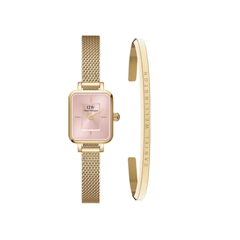 Quadro Mini Evergold Blush + Classic Bracelet set featuring a petite gold mesh watch with a rectangular blush pink dial and a slim gold cuff engraved with the Daniel Wellington logo, both crafted from stainless steel for a refined and modern look.