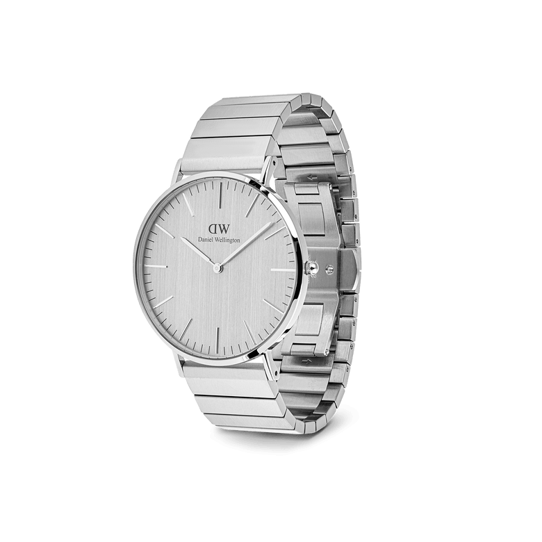 Classic Piano Link Silver Unitone men's watch with a 40mm brushed silver dial, minimalist markers, and a geometric stainless steel bracelet, shown at an angle to highlight its sleek and modern design.