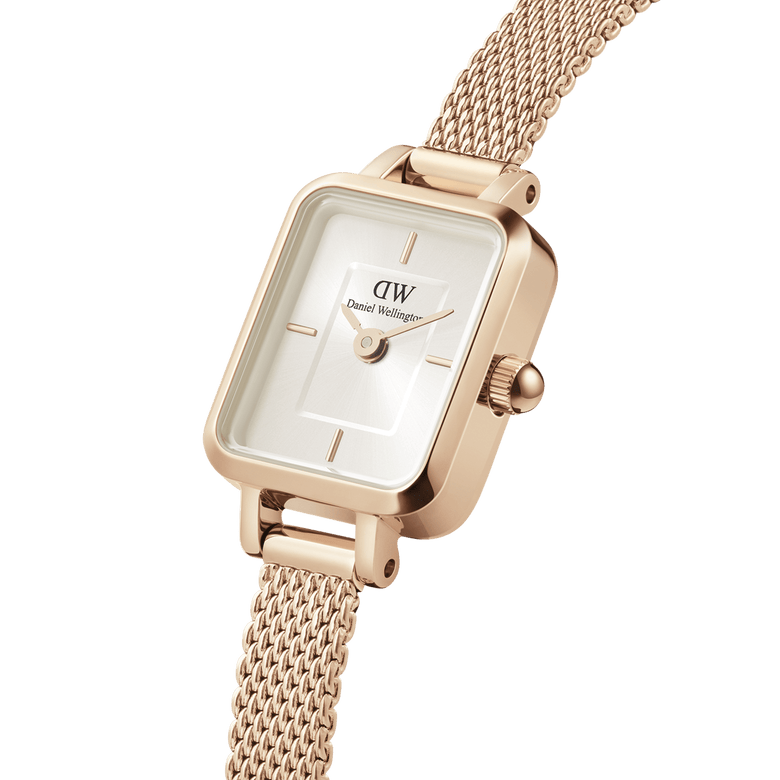 Close-up of the Quadro Mini Melrose Champagne watch showing its rectangular champagne dial, rose gold case, and finely woven mesh strap, highlighting the minimalist design and elegant finish.