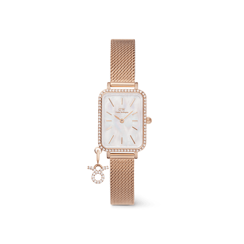 Rectangular rose gold women’s watch with a crystal-framed bezel, white mother of pearl dial, and an adjustable mesh strap, featuring a sparkling zodiac charm attached for a personalised touch.