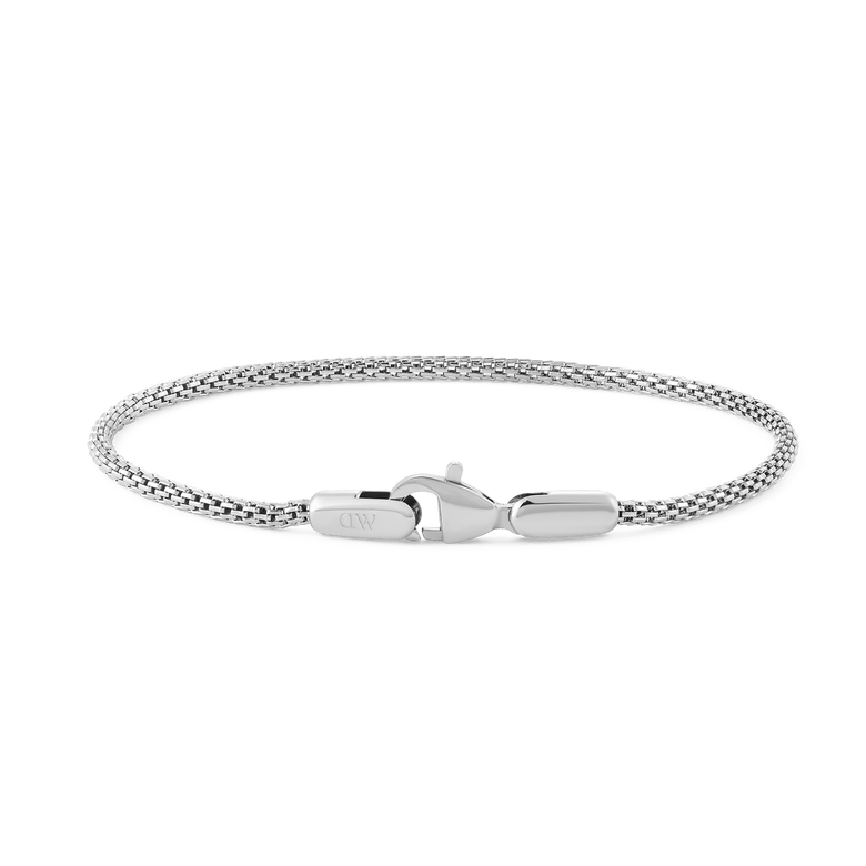 Slim silver mesh bracelet with a lobster clasp, crafted from stainless steel and designed for a comfortable, adjustable fit.