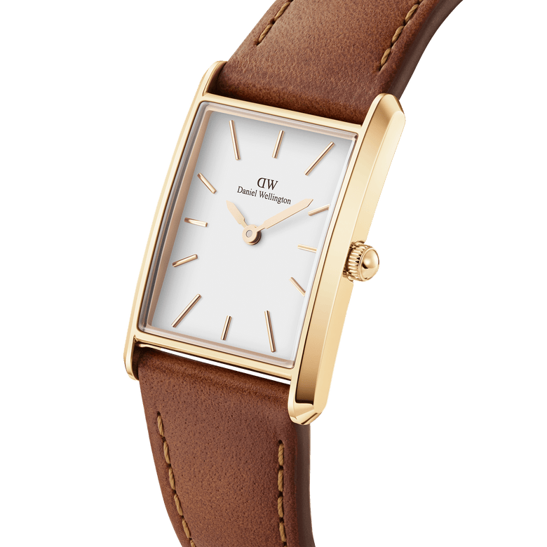 Bound Durham Gold women’s watch featuring a curved rectangular gold case, minimalist white dial with gold markers, and a stitched light brown leather strap, ideal for both work and casual wear.