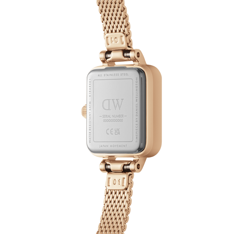The back of the Quadro Mini Melrose Emerald watch displays its stainless steel case, engraved branding, and rose gold mesh bracelet, highlighting its water resistance and Japanese movement details.