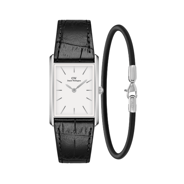 Rectangular silver Daniel Wellington watch with a white dial and black crocodile-embossed leather strap, paired with a slim Sheffield Bracelet in silver and black, both displayed against a plain background.