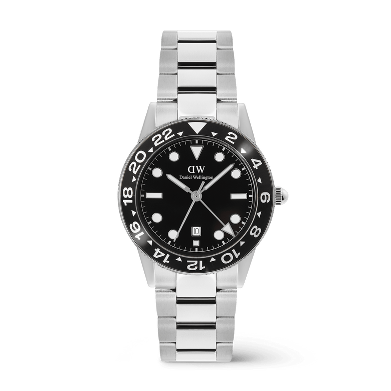 Stainless steel men’s watch with a black ceramic bezel, bold black dial, and silver link bracelet, featuring a GMT function and date display for versatile everyday and travel wear.