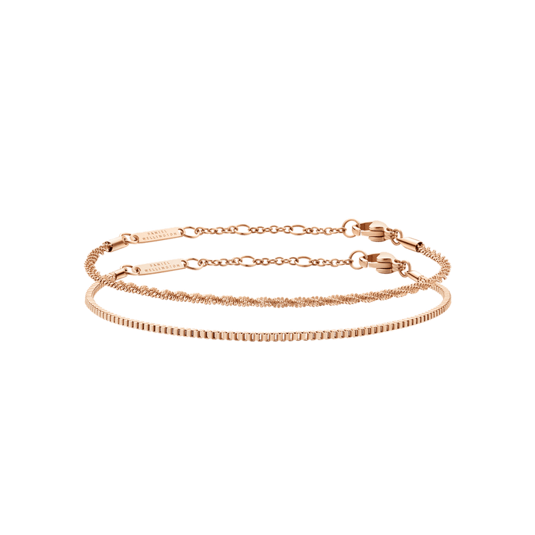 Two rose gold bracelets from the Staple Bracelet Set RG, featuring delicate chain designs with adjustable clasps and a polished finish, ideal for layering or wearing individually.