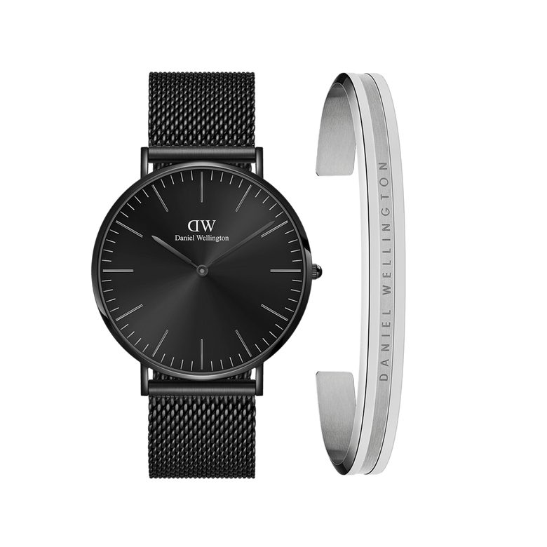A black mesh strap watch with a minimalist black dial is paired with a slim silver Elan Bracelet engraved with the Daniel Wellington logo, creating a modern and elegant accessory set.