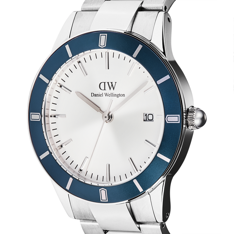 Detail view of the Iconic Paradigma Link Blue Bezel Silver watch, highlighting the satin matte blue bezel, crisp white dial, minimalist index markings, and date display on a polished stainless steel case.