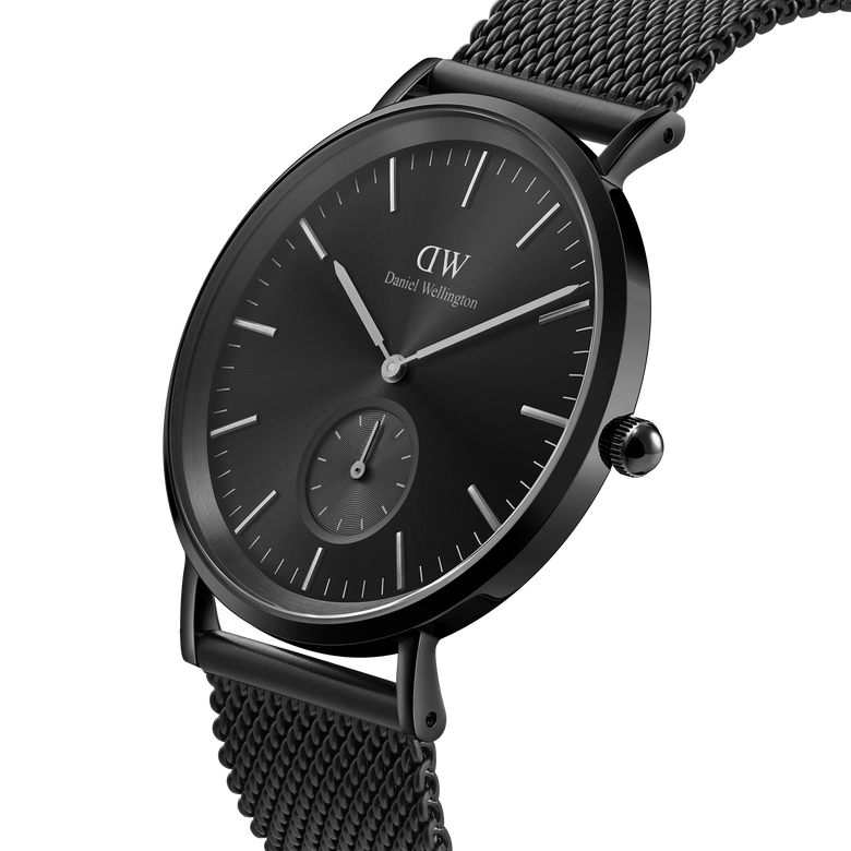 Classic Multi-Eye Ashfield Onyx men's watch with a 40mm black dial, minimalist hour markers, and a black mesh stainless steel strap, shown in a close-up angled view highlighting its sleek, modern design.