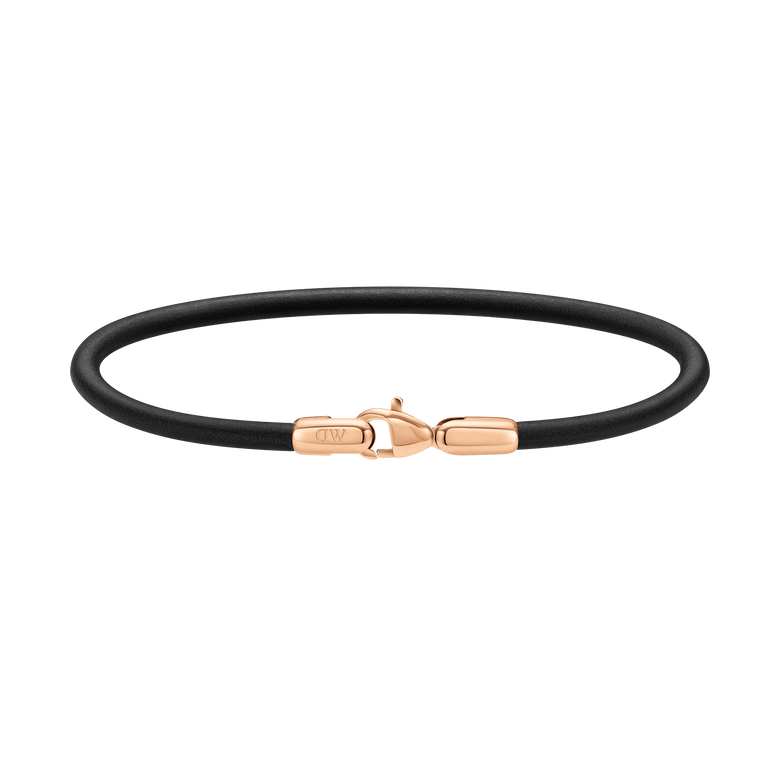 Slim men's bracelet featuring smooth black leather and a rose gold-plated stainless steel clasp, showcasing minimalist design and refined contrast.