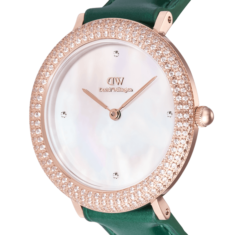 Close-up of the Crystalline Bezel Green Croc Rose Gold ladies watch, featuring a rose gold-plated case with a crystal-set bezel, white mother of pearl dial, and emerald green crocodile-embossed leather strap.