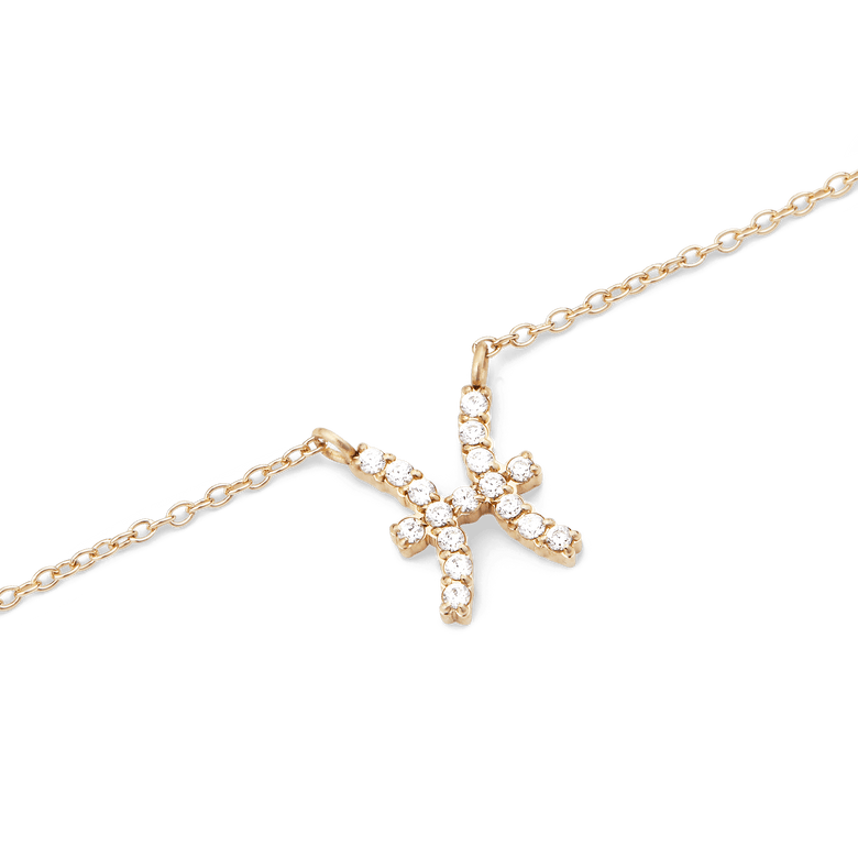 Close-up of the Crystal Zodiac Chain Necklace Gold showing a fine gold chain with a Pisces zodiac pendant, set with sparkling hand-placed crystals for a refined and personalised touch.
