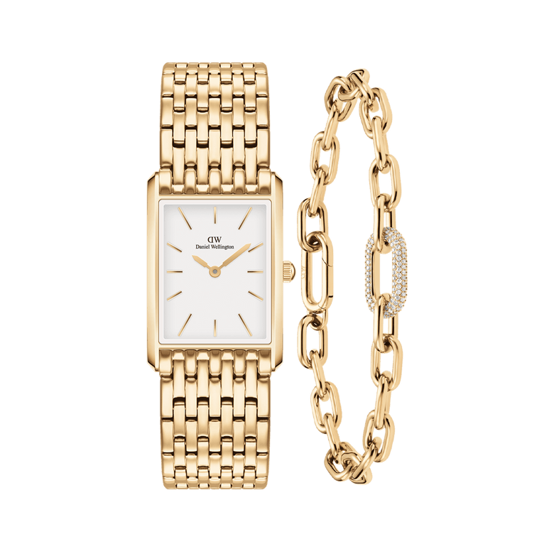 Gold rectangular watch with a white dial and nine-link bracelet strap, paired with a gold crystal link bracelet featuring pavé crystal detailing and delicate chain links.