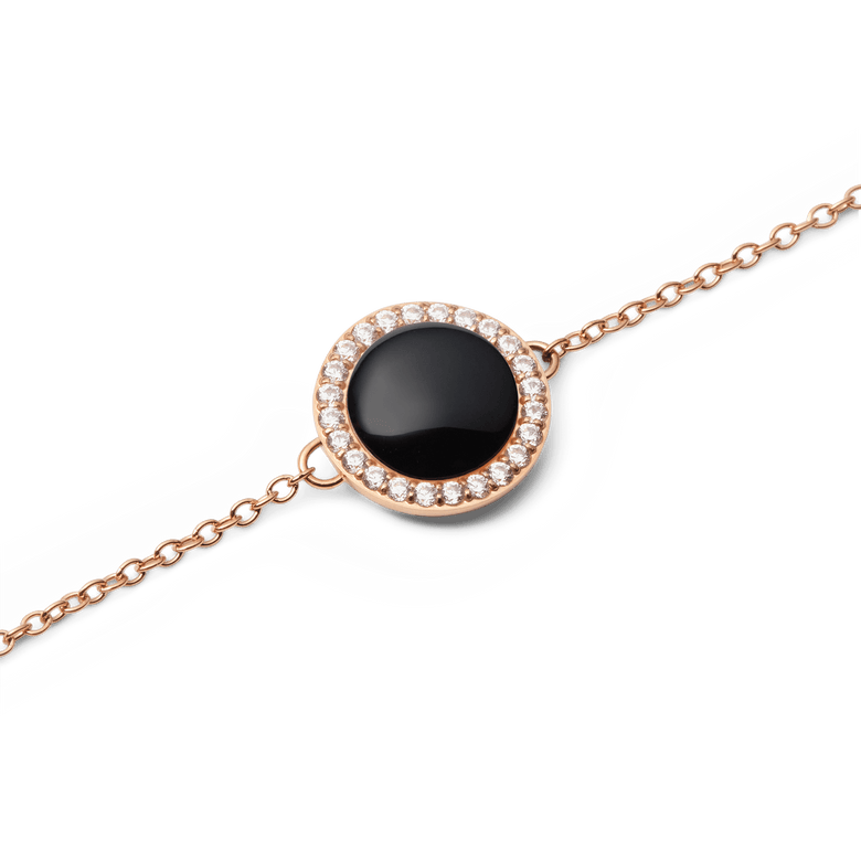 Close-up of the Audrey Bracelet Black Agathe Rose Gold, showing a polished black agate centrepiece surrounded by a halo of sparkling white cubic zirconia on a delicate rose gold chain.