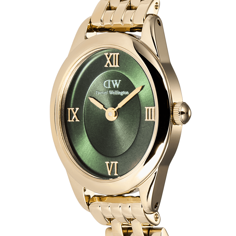 Close-up of the Ophelia Mini Emerald Gold watch showing its oval gold case, emerald green sunray dial, gold Roman numerals, and polished gold bracelet.