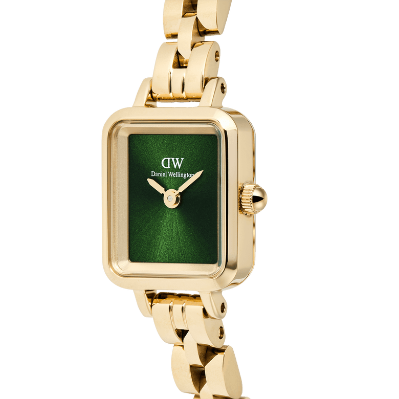 Close-up of the Quadro Mini Arch 3-link Emerald Sunray Gold watch, showing the rectangular gold case, polished gold bracelet, and vibrant emerald green sunray dial.