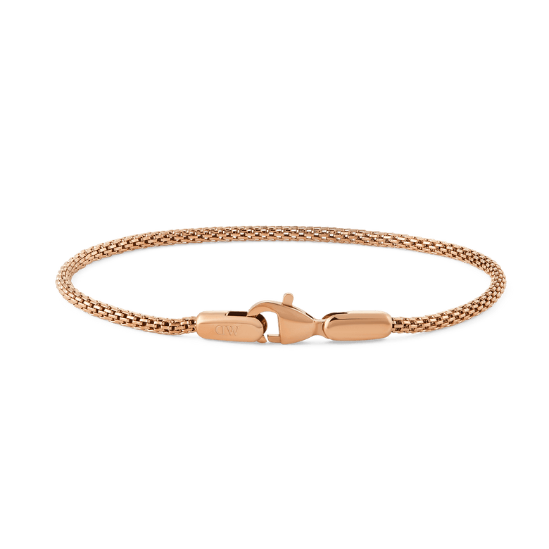 Slim rose gold mesh bracelet with a lobster clasp, featuring a delicate woven band and minimalist design suitable for layering or everyday wear.