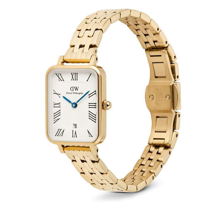 Quadro Roman Numerals Date gold watch for women featuring a rectangular gold case, white dial with Roman numerals, blue hands, and a five-link gold bracelet strap with a secure clasp.